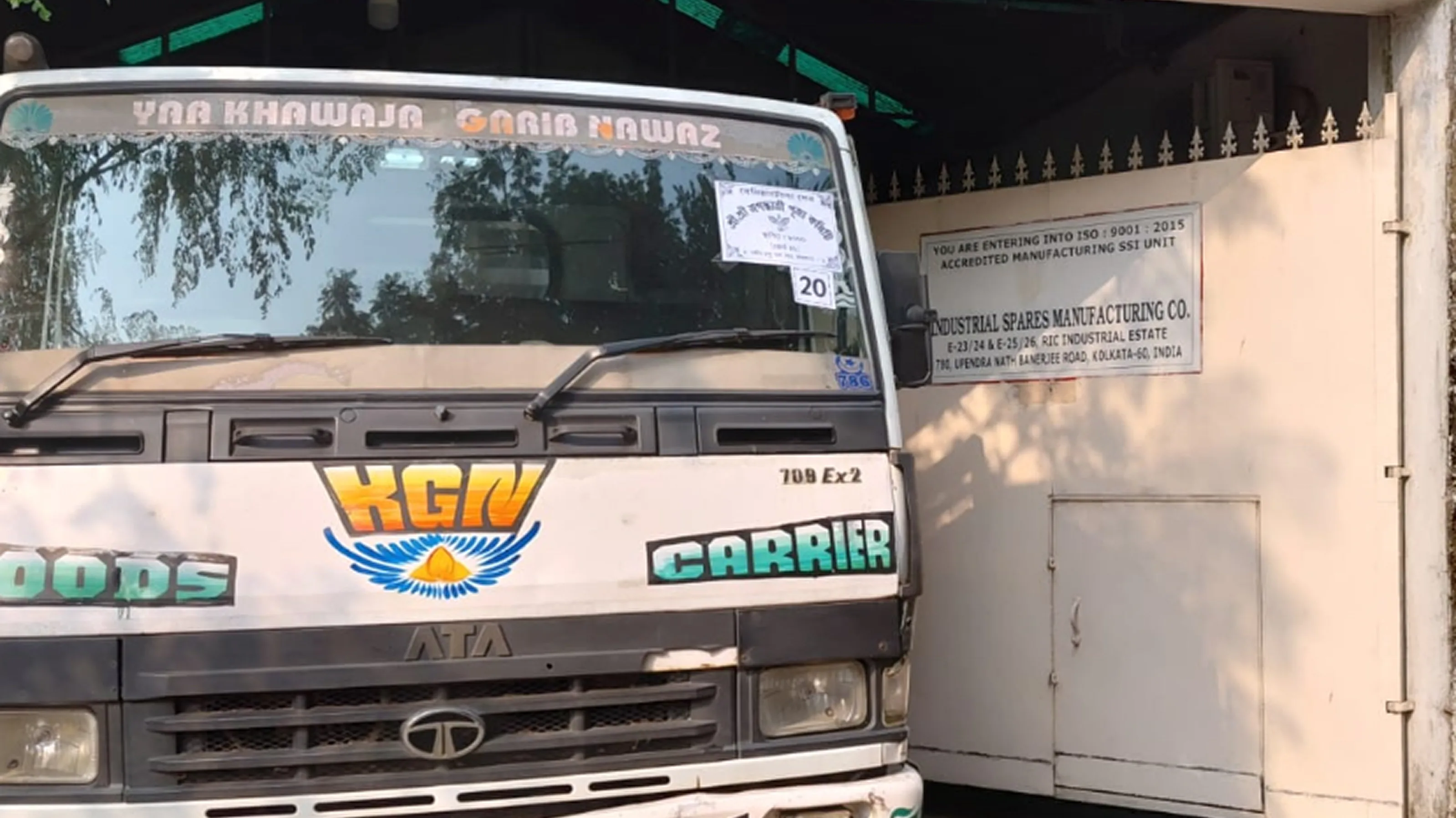 Delivery truck at the Industrial Spares Manufacturing Co. facility gate